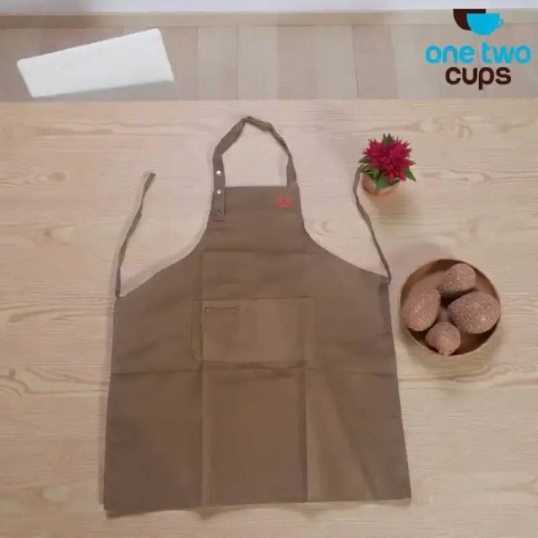 ginee_20260416175107529_1808884504.jpeg One Two Cups Celemek Masak Apron Dapur Canvas Strap Kancing - SP02