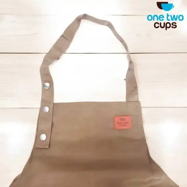 ginee_20260416175107628_3098424273.jpeg One Two Cups Celemek Masak Apron Dapur Canvas Strap Kancing - SP02